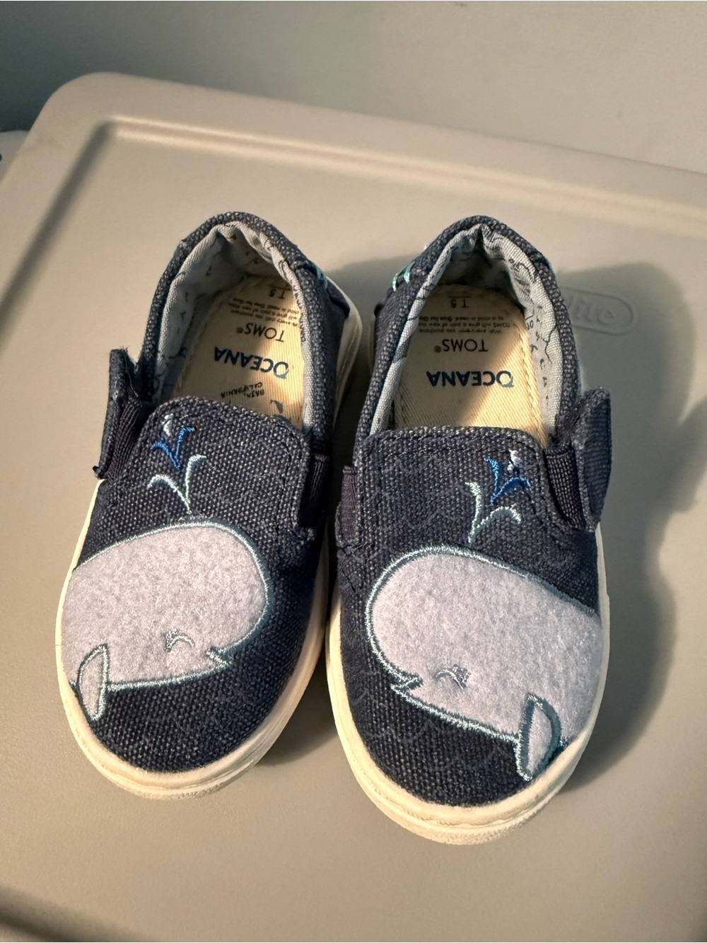 Toms Navy Canvas Slip-On Baby Shoes with Light Gray Whale Appliqués
